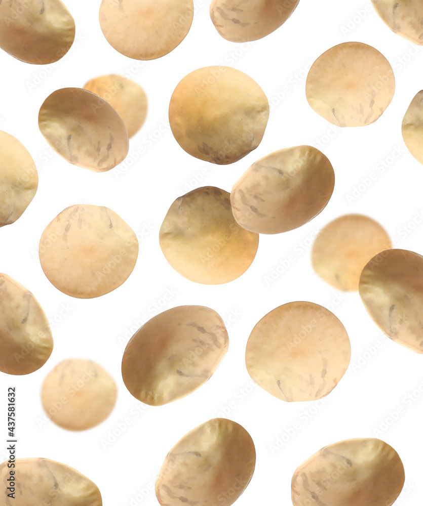 Many lentils falling on white background. Vegan diet Many lentils falling on white background. Vegan diet