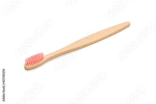 Bamboo toothbrush isolated on a white background.