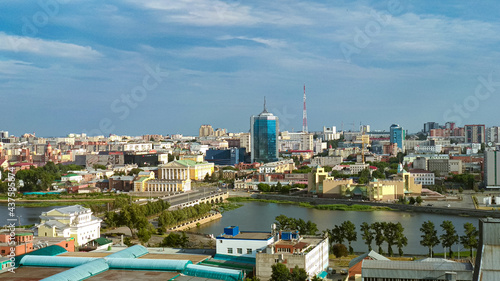 Skyscraper and river and sky. City panorama photo