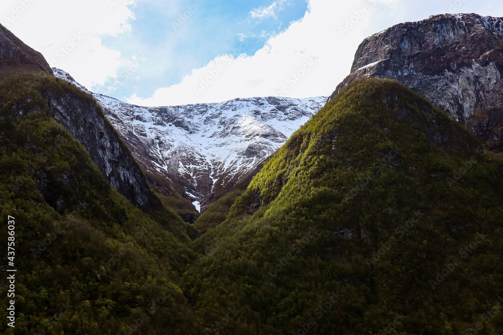 Snow capped mountains at spring in Nærøyfjord, Norway