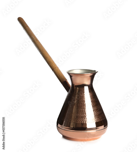 Beautiful copper turkish coffee pot with wooden handle isolated on white photo