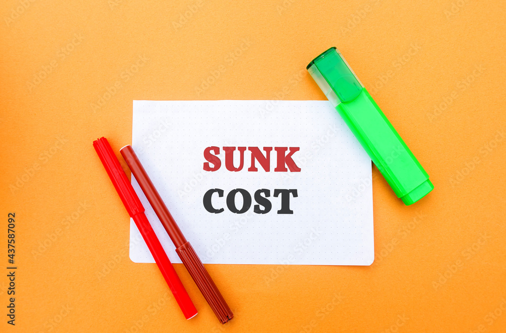 Note with words Sunk cost - retrospective cost and markers. Costs that cannot be recovered. Business and finance concept Note with words Sunk cost - retrospective cost and markers. Costs that cannot be recovered. Business and finance concept