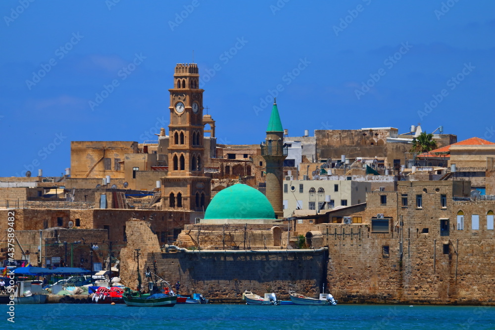 mosque and clock tower in the port