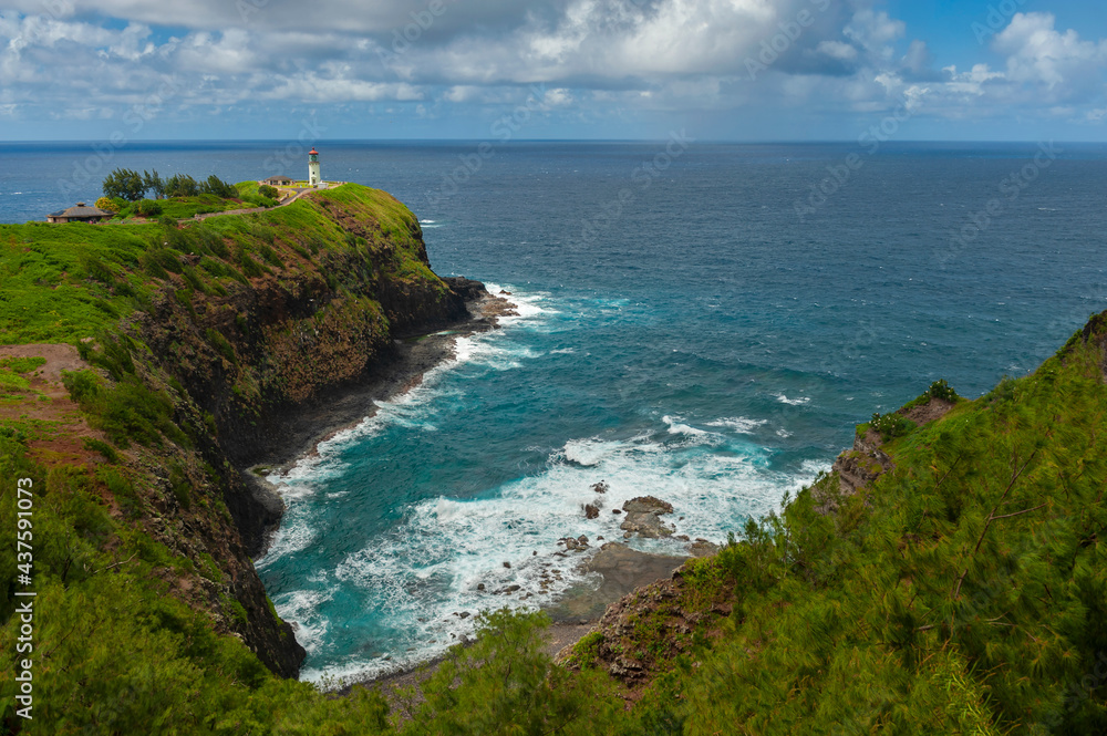 Fototapeta premium Kilauea Lighthouse, Kauai, Hawaii. Kīlauea Lighthouse is located on Kīlauea Point on the island of Kauaʻi, Hawaiʻi in the Kīlauea Point National Wildlife Refuge. A popular place for bird watching.