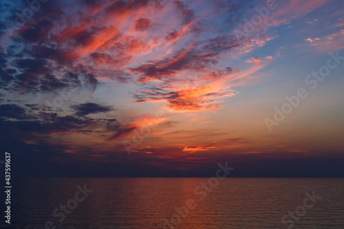 Fototapeta Naklejka Na Ścianę i Meble -  A stunning pink and orange sunset sky in the middle of Mediterranean sea, sunset background.