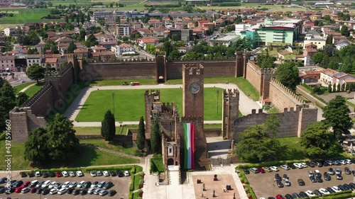 Aerial view of the Italian historic castle Castello Scaligero, view of the Villafranca di Verona. Flag of Italy at Scaligero Castle. Historical part of the city Villafranca di Verona, Verona, Italy.