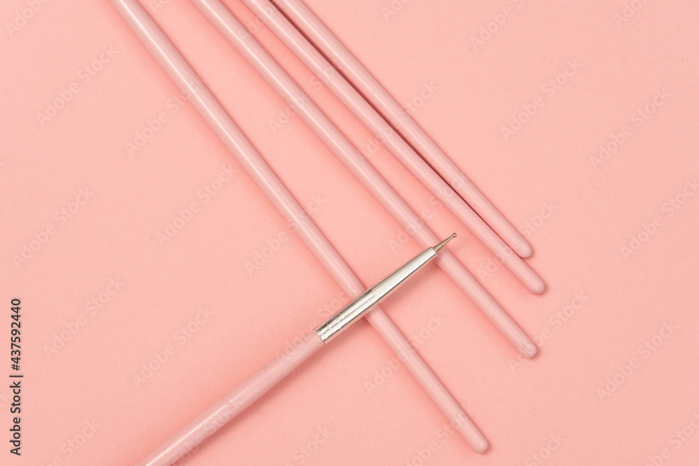 cosmetic flat lay: pink makeup brushes on pink background cosmetic flat lay: pink makeup brushes on pink background