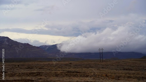 Dramatic storm clouds over mountain peak timelapse