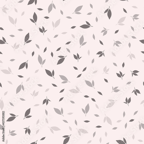 Pattern with leaves on a beige background. Vector image.