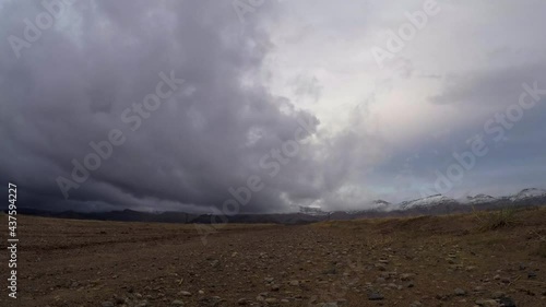 Dramatic storm clouds over mountain peak timelapse