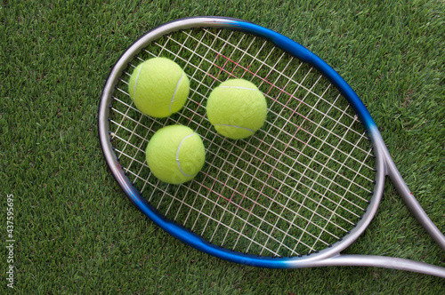 Tennis balls and racket © Pixelbliss