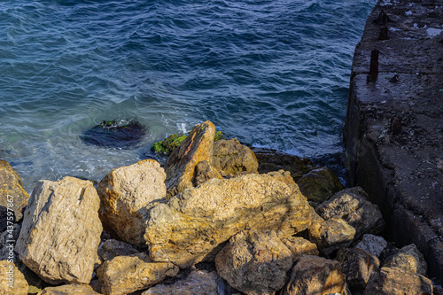 Mossy stones on the coastline of the sea