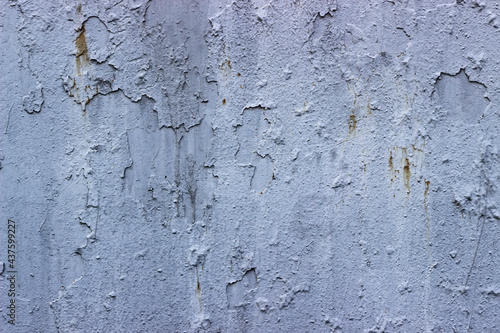 Texture of a gray paint ragged metal wall of a naval warship.