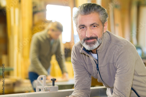 smiling carpenter at work in workshop © auremar