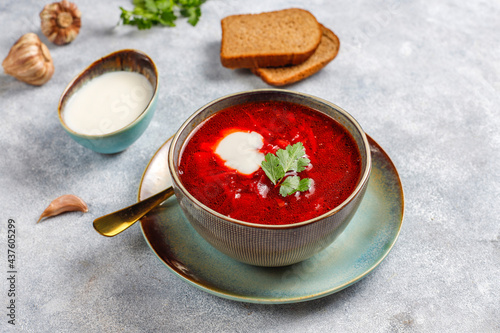 Traditional Ukrainian Russian borscht or red beetroot soup in the bowl.