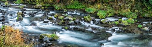 Forest stream panorama with rocks  photo