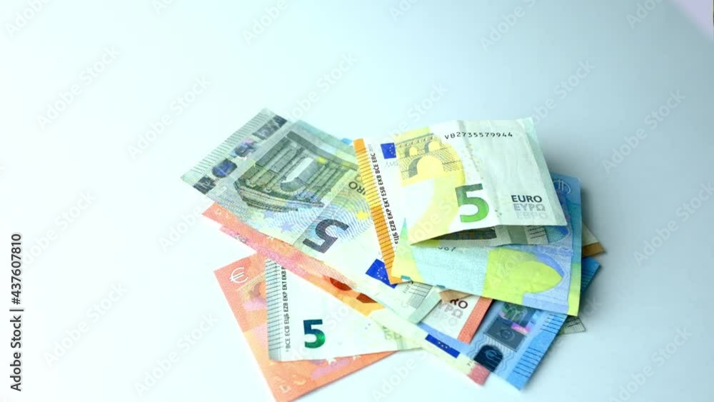 paper banknotes of the european union, euro money falling on the table from above, scattering, slow motion, concept of cash, payments, savings, banking operations paper banknotes of the european union, euro money falling on the table from above, scattering, slow motion, concept of cash, payments, savings, banking operations