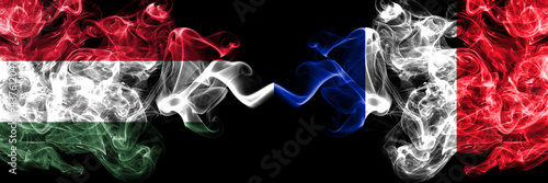 Hungary, Hungarian vs France, French smoky flags side by side.