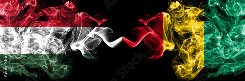 Hungary, Hungarian vs Guinea smoky flags side by side.