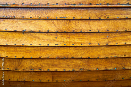 The wooden hull of a small boat photo