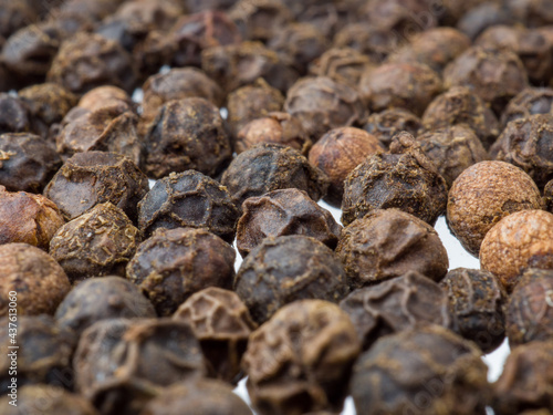 Close-up dried black peppercorns. Selective focus.