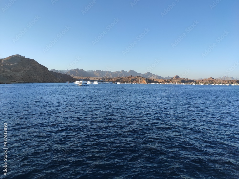 View of endless mountains and yachts in the Red sea