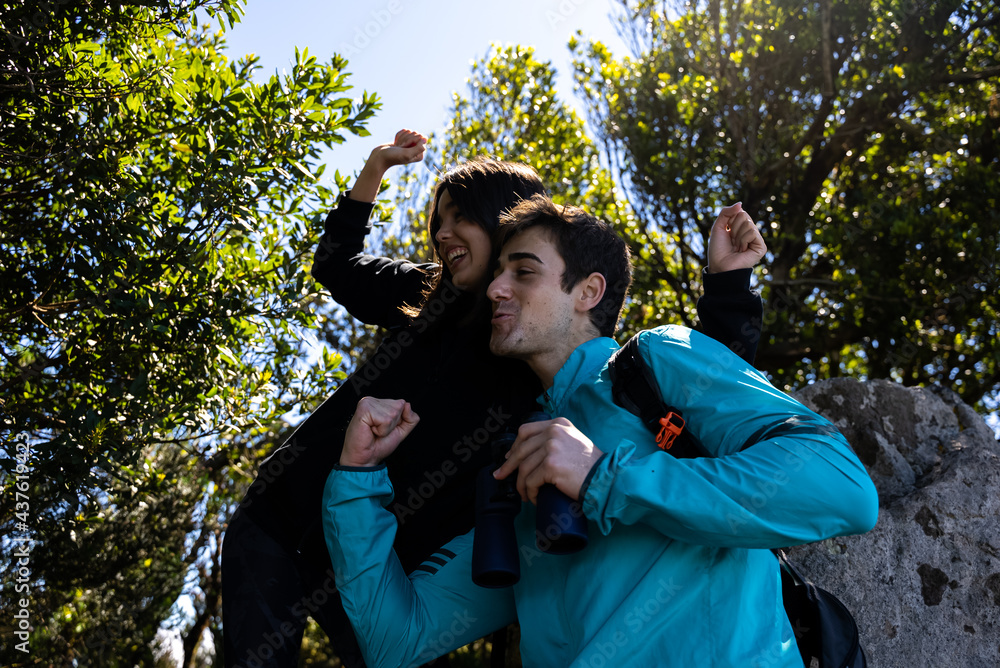 couple on a walk in the mountain and forest looking at the vegetation and landscape on vacation
couple on a walk in the mountain and forest looking at the vegetation and landscape on vacation