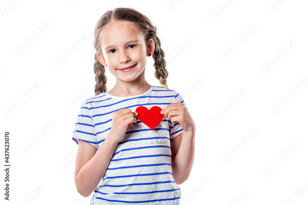 Cute little girl smiling and holding red decorative heart isolated on white background Cute little girl smiling and holding red decorative heart isolated on white background