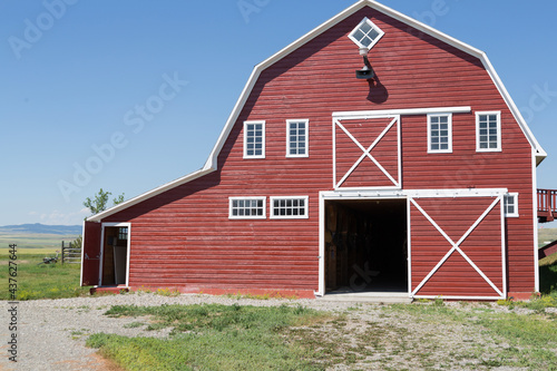 Photos close up of a red barn on a bright sunny day