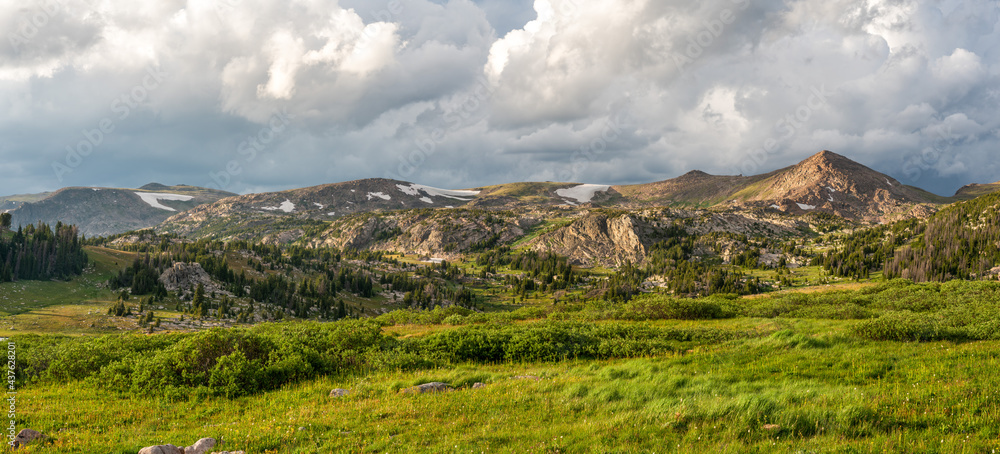 Beautiful late day sunlight and clouds Beartooth Scenic Byway near Long Lake in Wyoming