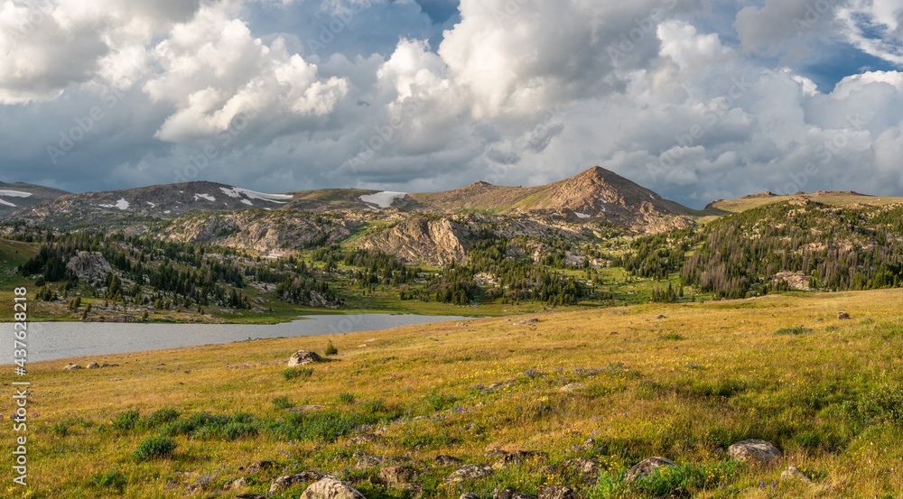 Beautiful late day sunlight and clouds Beartooth Scenic Byway at Long Lake in Wyoming