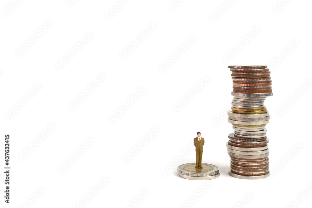 Miniature figures businessman stand on coins, on the white backgroud. Miniature figures businessman stand on coins, on the white backgroud.