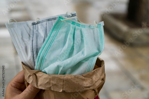 hygienic masks in paper bag.Mask is medical supplies for prevents the spread of germs or Covid-19 virus or protect yourself from PM2.5 air pollution and hazardous dust.