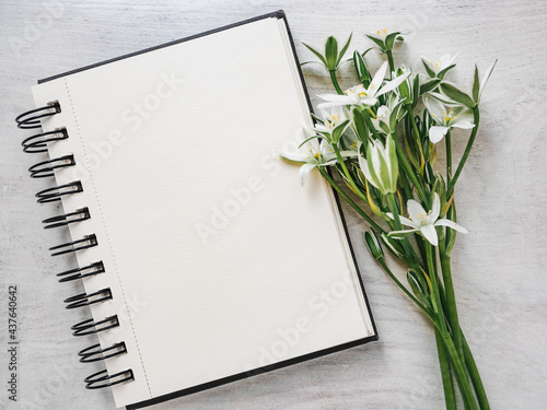 Blank notepad page for your congratulatory message. Closeup  view from above. No people. Concept of preparation for a holiday. Congratulations for relatives  friends and colleagues