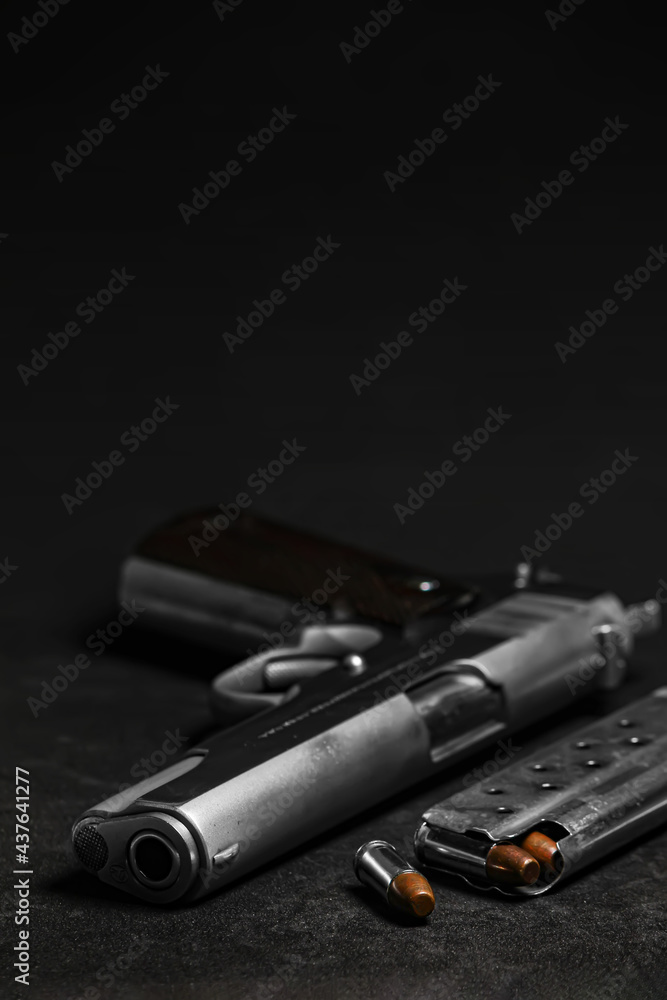 Automatic white gun stainless steel pistol weapon model m1911 with real bullet ammo and magazine with black background