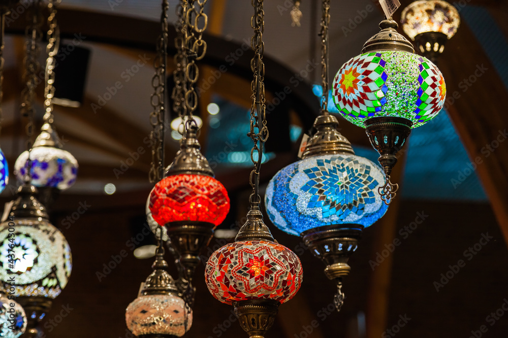 Turkish luminous chandeliers hanging from the ceiling in the Istanbul Bazaar.