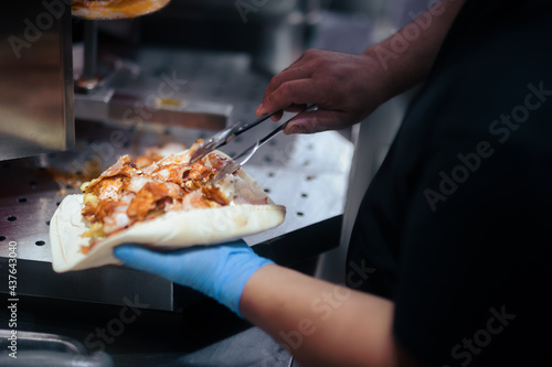 Restaurant Cook Putting Chicken Meat in Pita Wrap Making a Traditional Dish