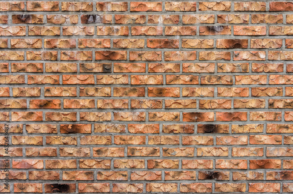 Wall constructed with bricks of various shades. The decorative designs for using as background, pattern and texture. Wall constructed with bricks of various shades. The decorative designs for using as background, pattern and texture.