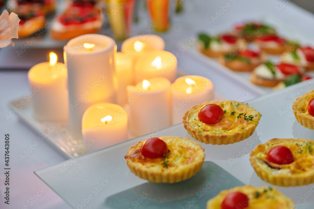 Candle and snack on table
