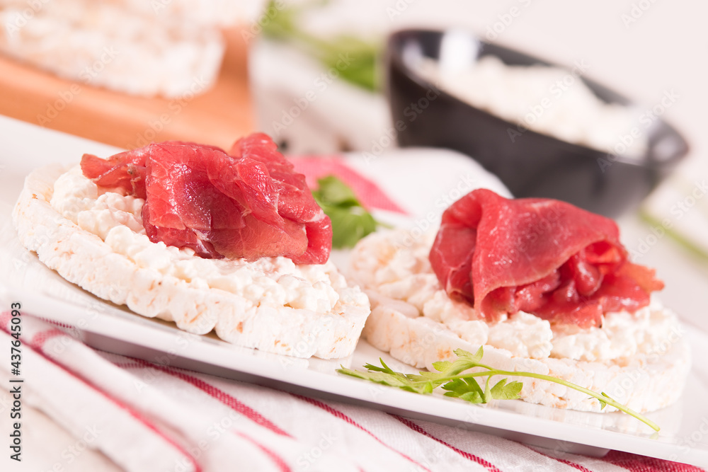Rice cakes with milk flakes and cold beef. Rice cakes with milk flakes and cold beef.