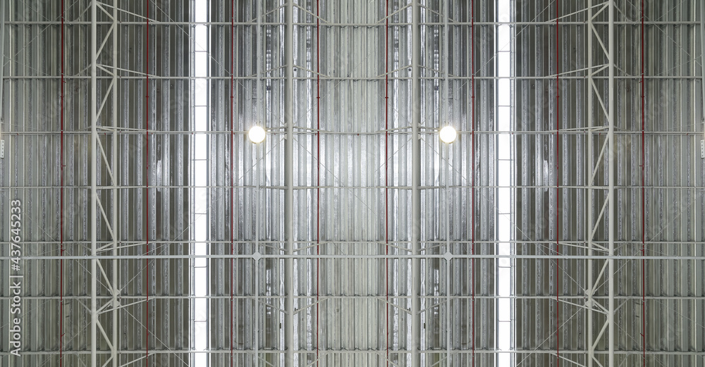 Roof top of industrial background, roof structures of industrial building. Structural of roof industrial. Background and texture of steel structures and light bulb Roof top of industrial background, roof structures of industrial building. Structural of roof industrial. Background and texture of steel structures and light bulb