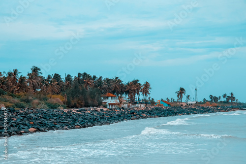 Fototapeta Naklejka Na Ścianę i Meble -  PONDICHERRY, INDIA - July 14:Yacht at the sea in. Aerial view of harbour at sunset. Colorful landscape with stone rocks, blue sea. Top view from drone of Harbour