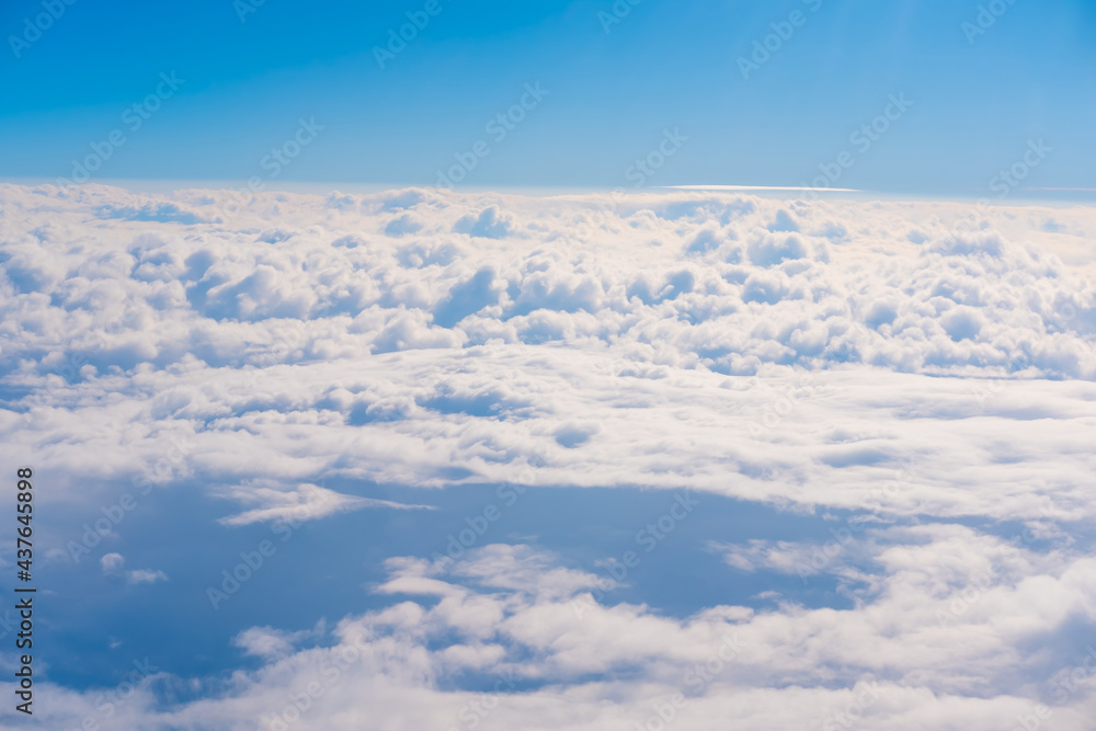 Top view from fly, aerial view of clouds in blue sky