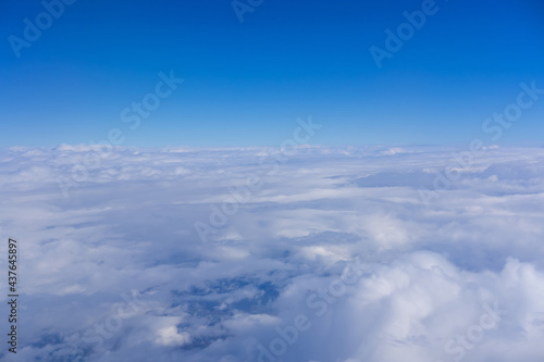 Top view from fly, aerial view of clouds in blue sky