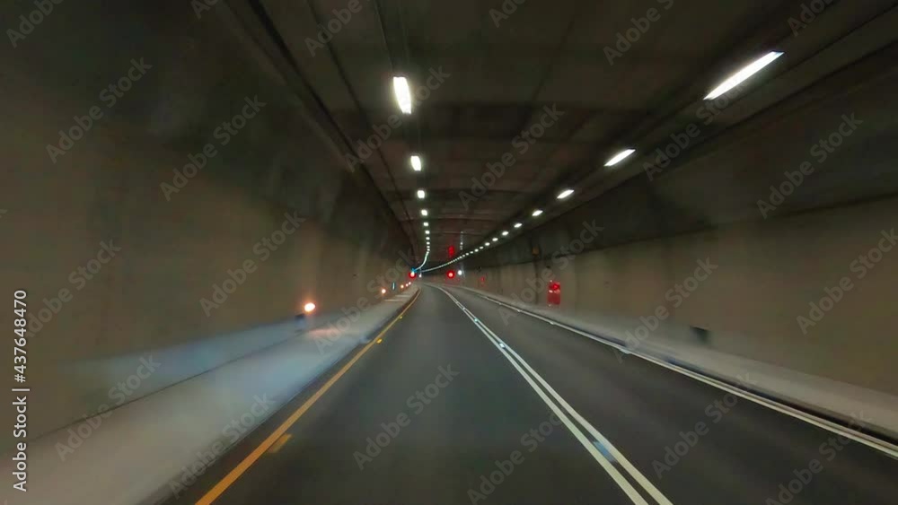 Driving car in the city through the tunnel Driving car in the city through the tunnel
