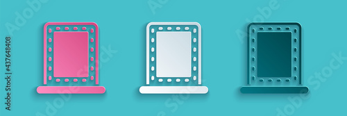 Paper cut Makeup mirror with lights icon isolated on blue background. Paper art style. Vector