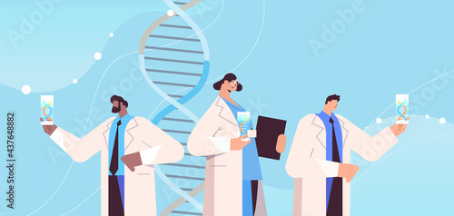 mix race scientists working with DNA researchers making experiment in lab DNA testing genetic diagnosis concept