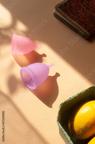 Menstrual cups minimalistic sunny image flat lay top view background with copy space photo