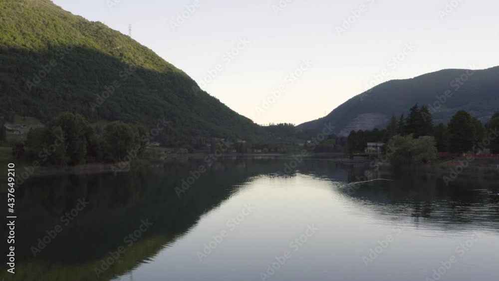 Drone flying over Lake Endine with the mountains in the background,Lombardy,Italy. Drone flying over Lake Endine with the mountains in the background,Lombardy,Italy.