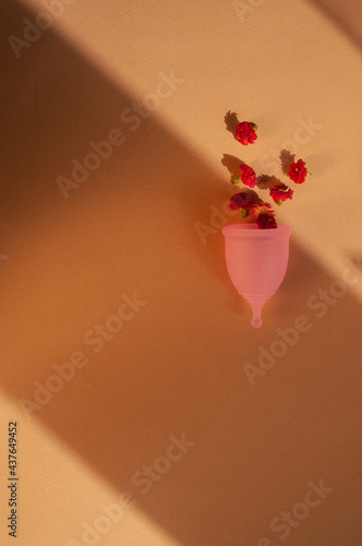 Menstrual cups minimalistic sunny image flat lay top view background with copy space photo